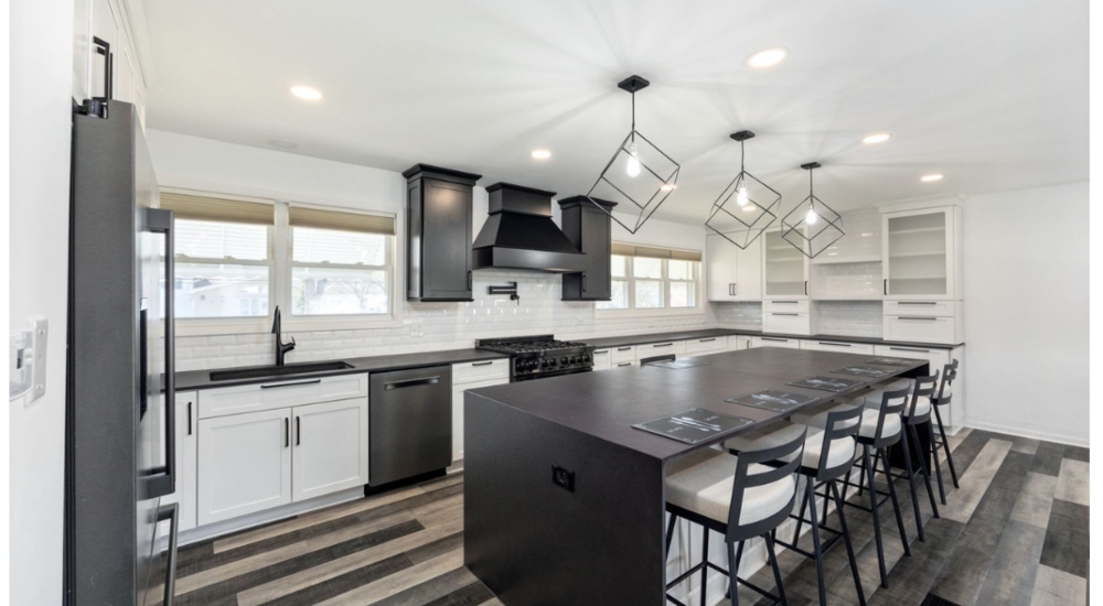 Custom kitchen with decorative pendant lights showcasing the intersection of design and technology