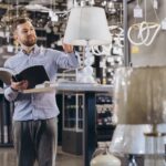 Man shopping for lighting fixtures as a metaphor for price pressure and value proposition when selling lighting and shading