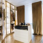 Custom lighting installation inside fancy luxury walk-in closet with shades