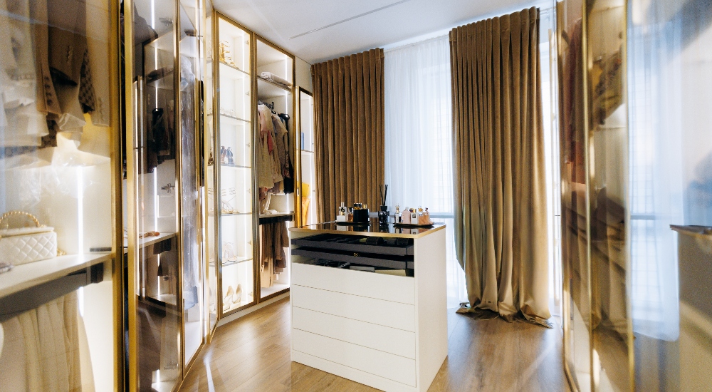 Custom lighting installation inside fancy luxury walk-in closet with shades
