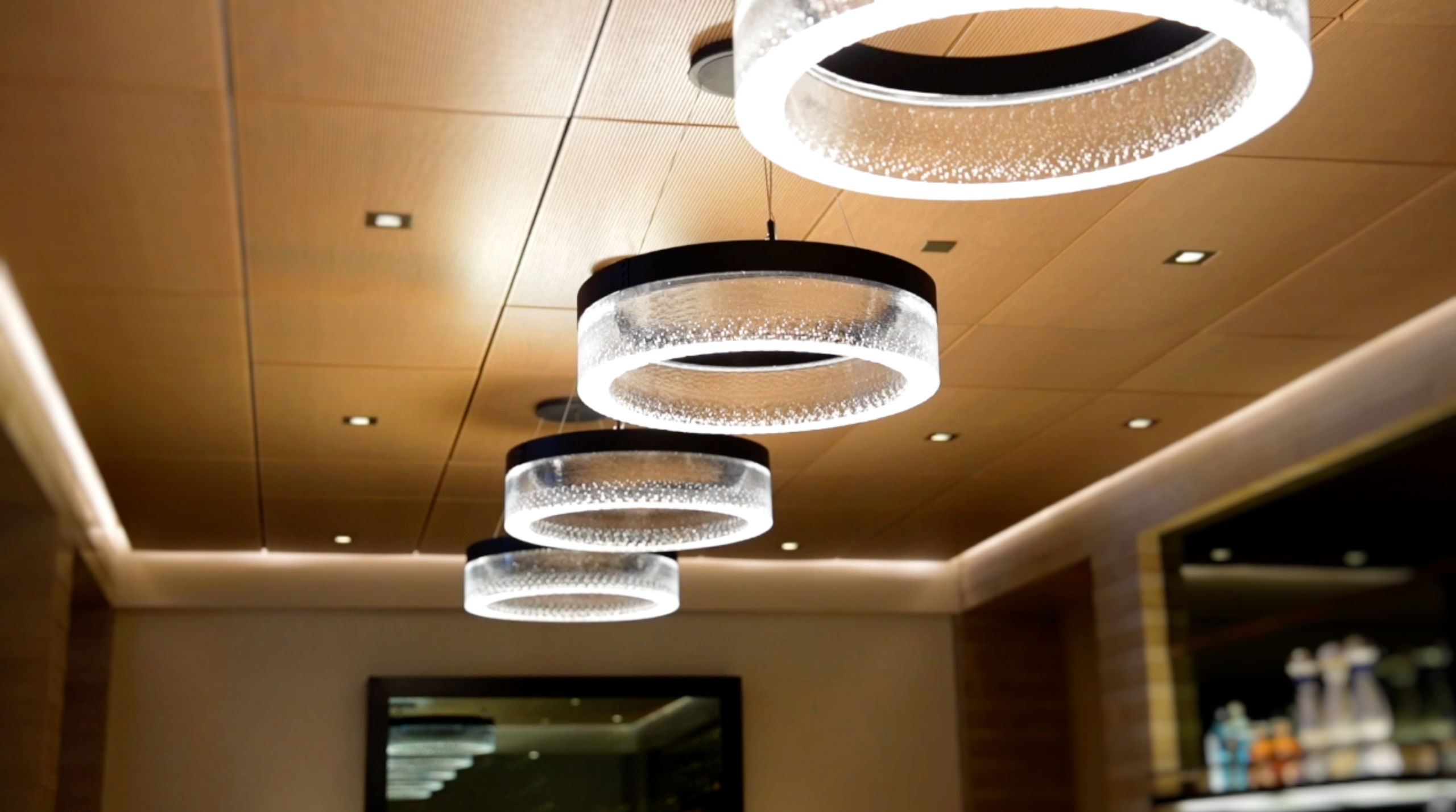 Architectural circular ceiling lighting fixture in a luxury Palo Alto smart home, integrated into a Lutron HomeWorks tunable lighting system programmed for circadian scene control by AudioVisions