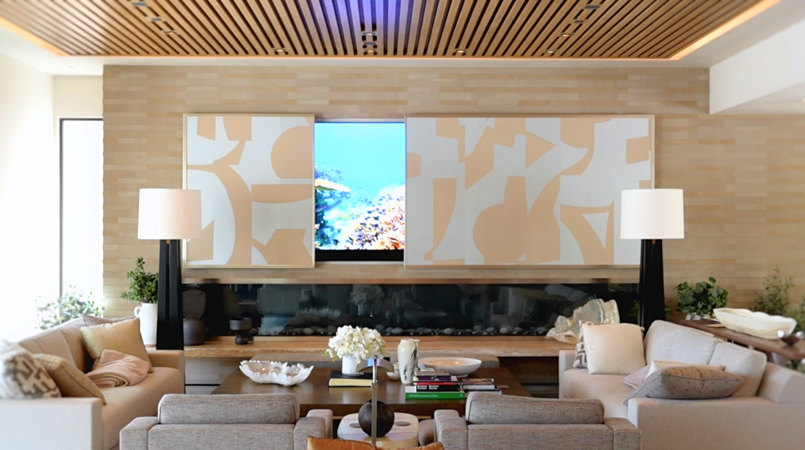Sequential shot of a motorized panel retracting to reveal a concealed flat screen display in a Palo Alto luxury residence, showcasing hidden AV integration as part of AudioVisions' whole-home automation and tunable lighting design